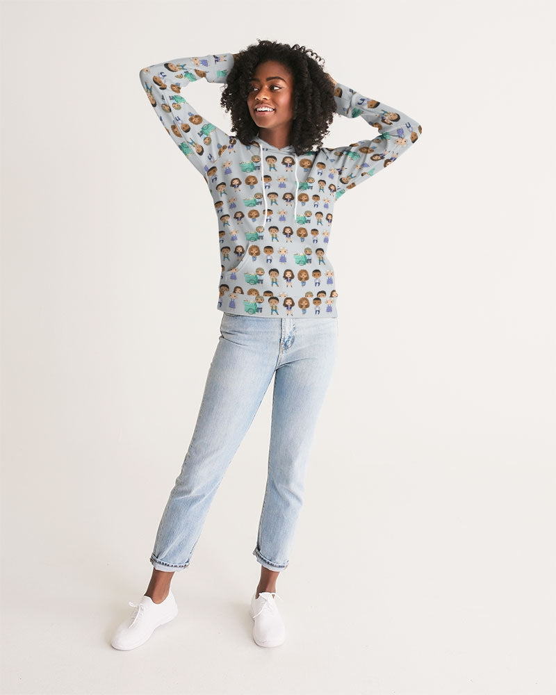 dark skinned woman with hands behind head and smiling with natural curly hair modeling grey sweatshirt with illustrated character repeating print